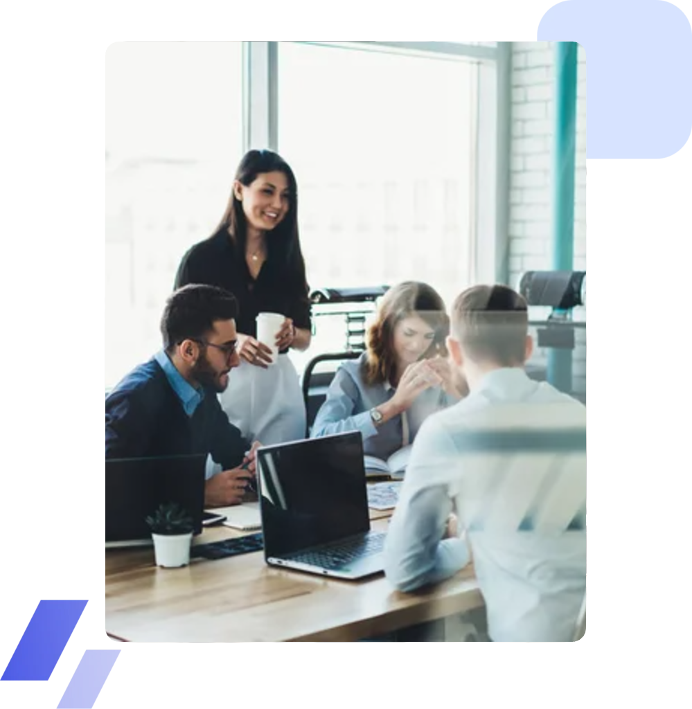 A consulting team in discussion around a meeting table