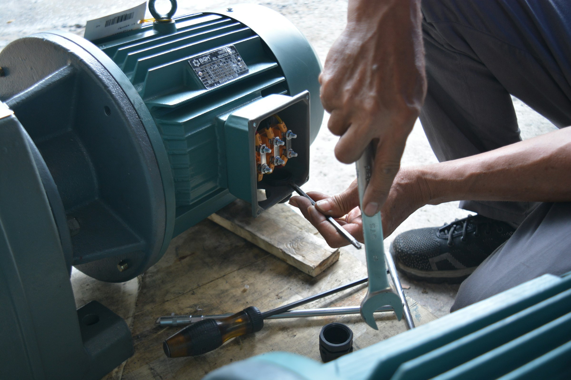 An engineer working on an electric motor assembly.