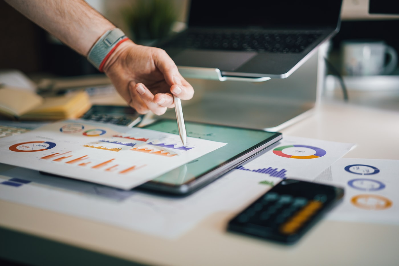 Charts and a model reviewed on a tablet